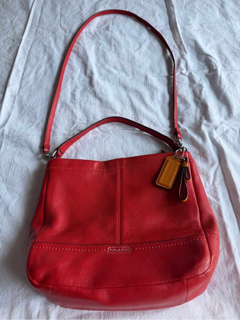 Coach Red Pebbled Leather Shoulder Bag with Tan Charm
